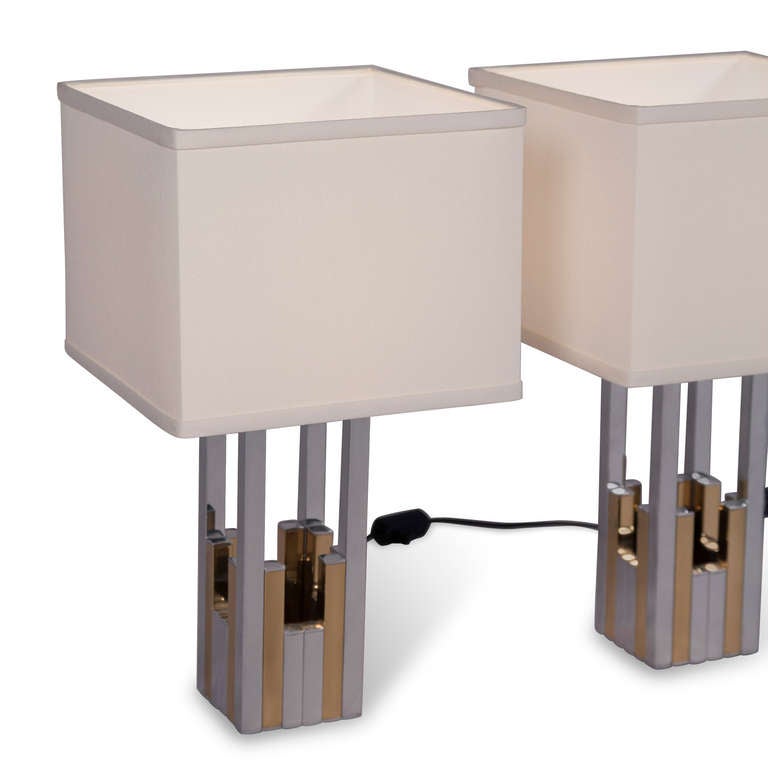 Chrome and brass table lamps, open rectangular column form with alternating chrome and brass elements, by Willy Rizzo for Lumica, Italian, 1970s. Overall height 18 in, base is 3 3/4 in square. Shade measures 10 in square, shade height 8 in. (Item