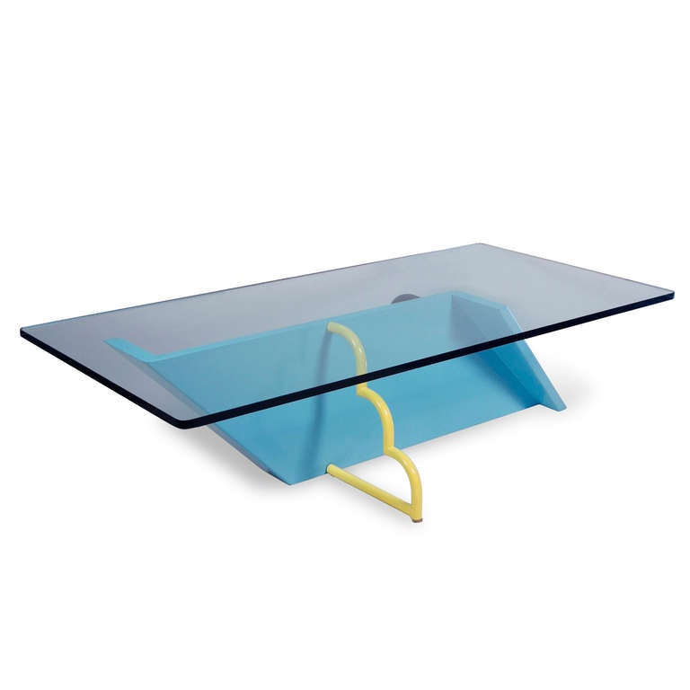 Baby blue lacquered base coffee table, with pale blue/green rectangular glass top, the blue base in a elongated Z-shape, and having a yellow and a black lacquered metal tubular side support, by Milo Baughman for Thayer Coggin, early 1980s. The glass