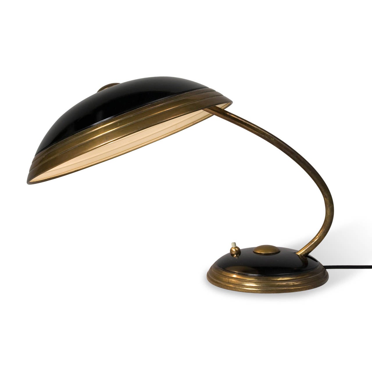 Patinated brass and black lacquered metal dome desk lamp, the shade as well as the arm pivoting up and down, By Helo, German 1950s. Height 14 in, diameter of shade 12 1/4 in.