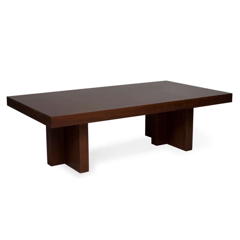 Rectangular solid mahogany coffee table, the thick slab top resting on two cruciform pedestals, American 1960s. 54 x 30 in, height 16 in. (Item #1696)