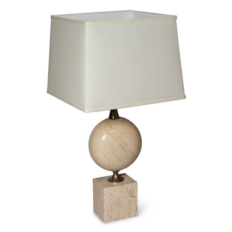 Pair of large polished travertine and chrome table lamp,s the travertine cube shaped base separated from a disc shaped travertine element by chrome connectors, in custom silk shade, by Maison Barbier, French 1970s. Overall height 32 1/4 in, Shade