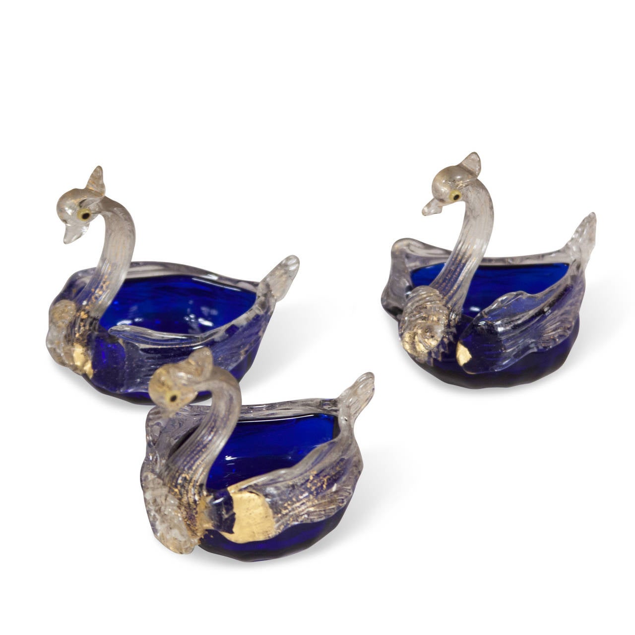 Set of three handblown glass swans, in clear and blue with gold inclusions, Murano, Italy, 1960s. Height 3 in, length 4 in, width 2 1/2 in.