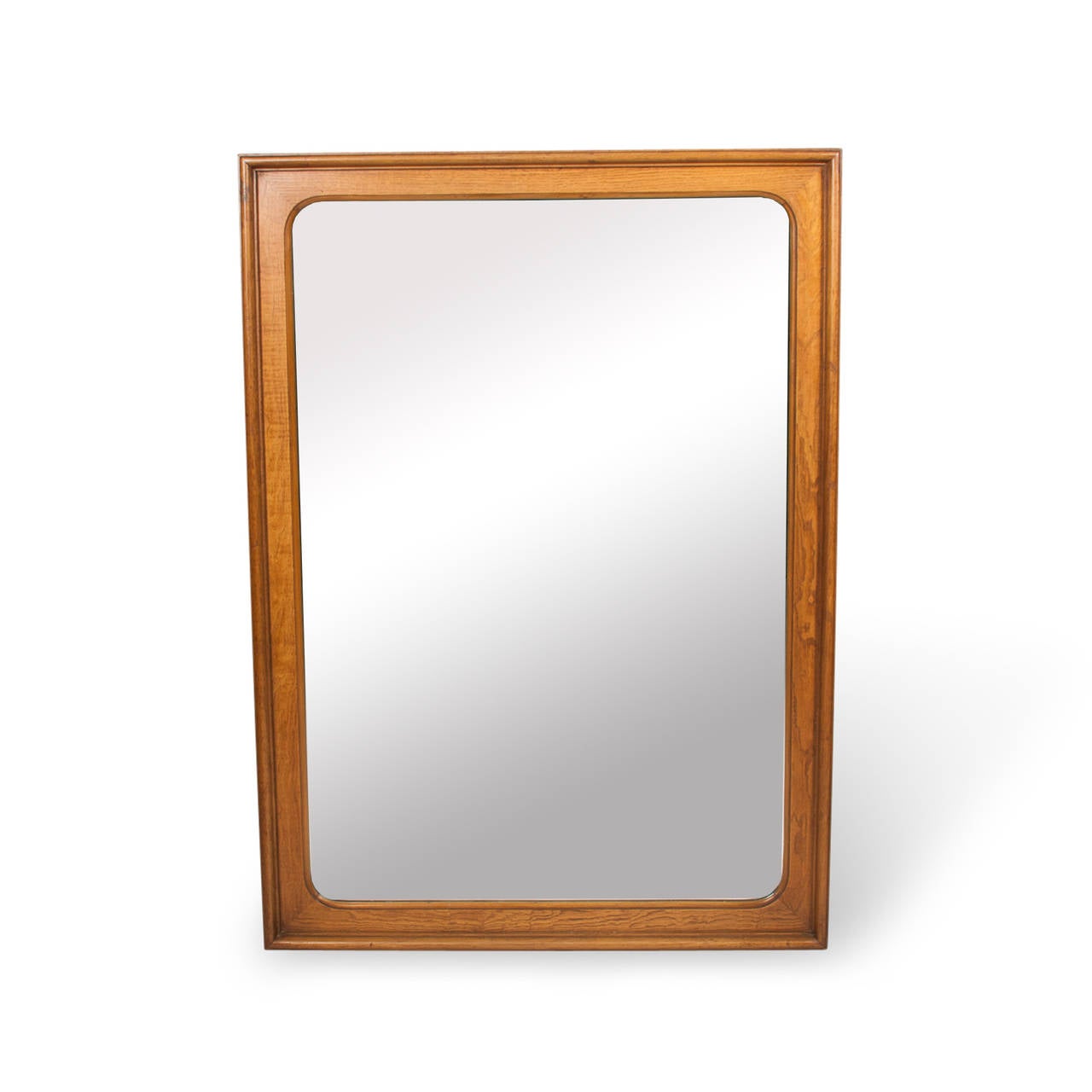 Maple rectangular frame mirror, the inside corners of the frame having a radius edge, American, 1960s. 42 x 30 inches, depth 1 1/2 in.