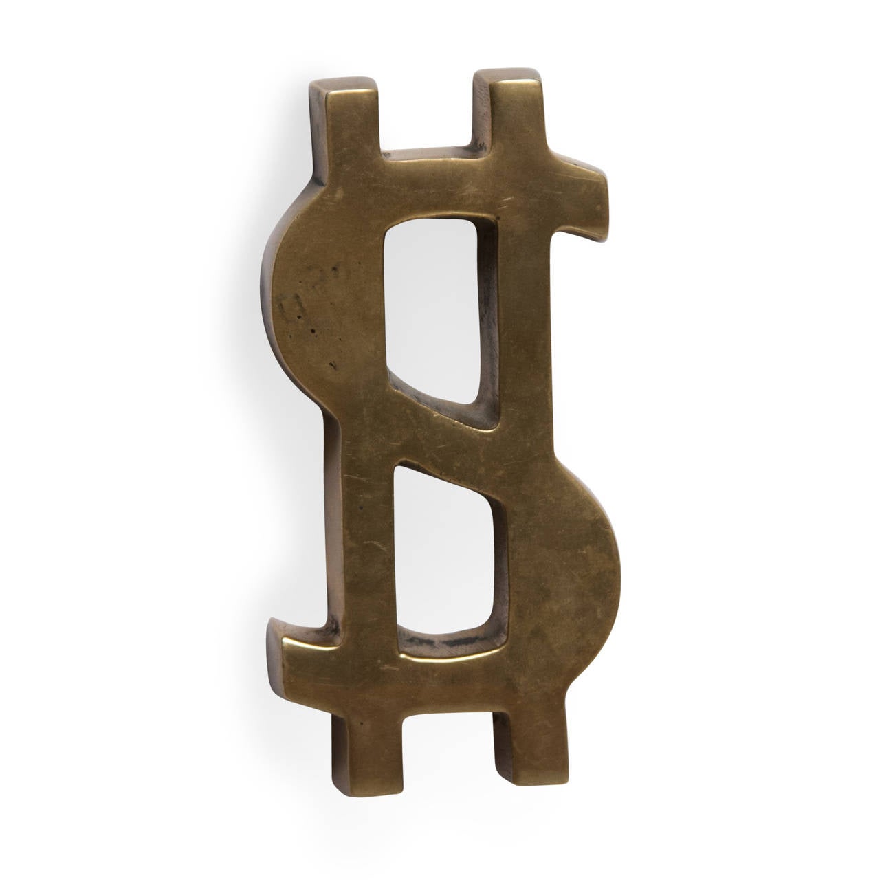 Solid bronze sculpture of a dollar sign, American, 1960s. 4 3/4 in x 2 1/2 in, height 1/2 in.