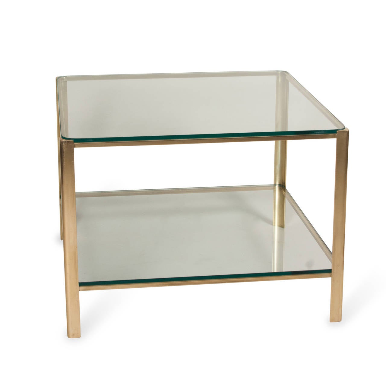 Brass frame square coffee table, glass top with rounded corners, lower glass shelf by Maison Malabert. French, 1940s. Stamped markings to inside edge. Attributed to Jacques Quinet. Measures: 24 in square, height 17 in.