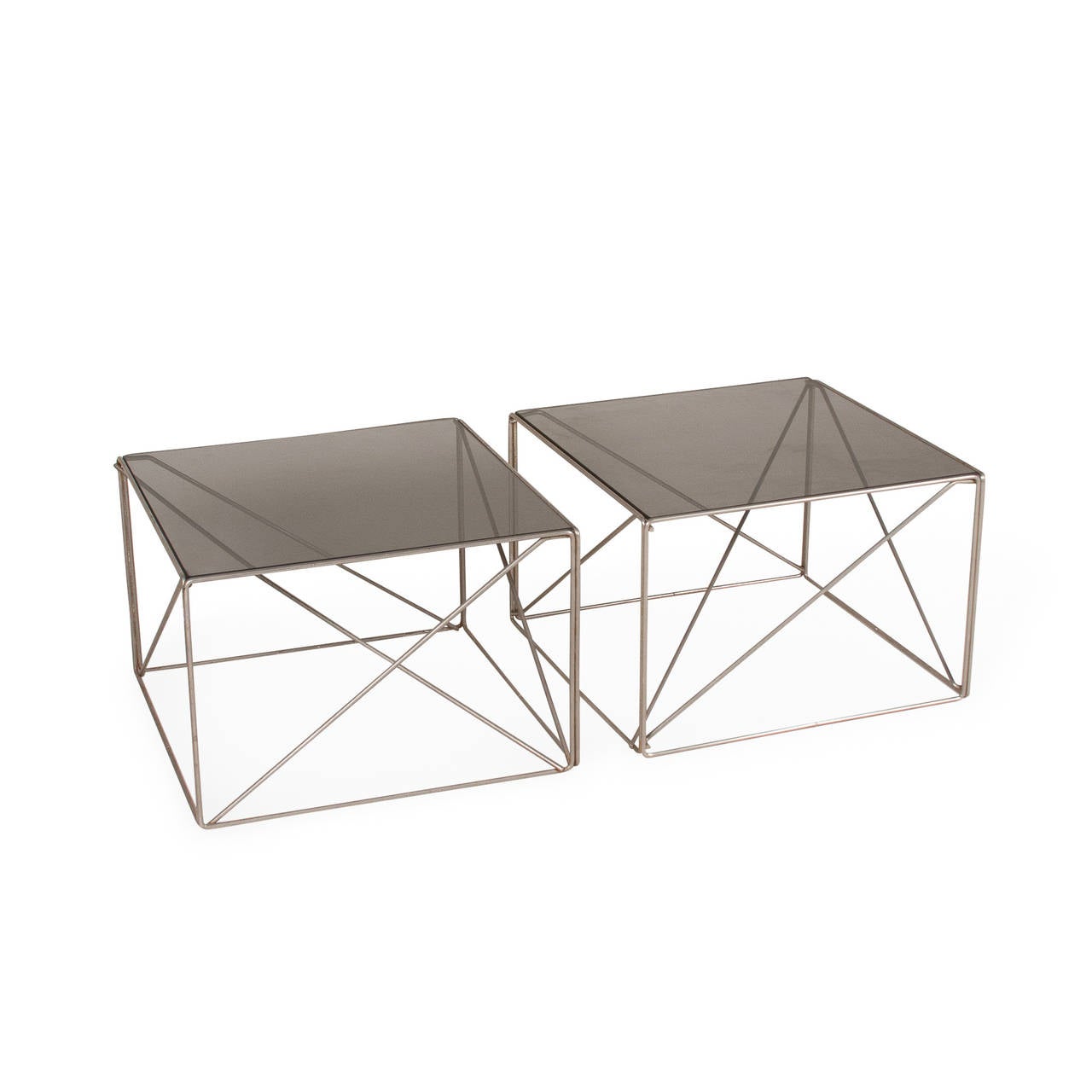 Pair of chrome rod frame end tables, the rods arranged in various intersecting triangles, with smoky grey glass top, by Max Sauze for Rouve, French, circa 1970. 17 1/2 in square, height 12 in. (Item #2267)