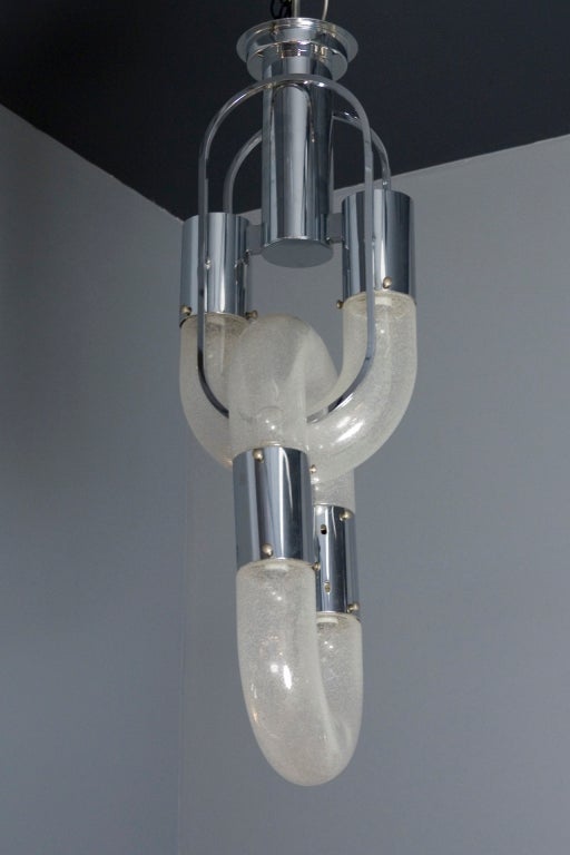 Clear and white pelaguso glass and chrome chandelier, the two parts joined as a chain, by Aldo Nason for Mazzega, Italian 1970s. Overall height 33.5 in. (Item #1077)