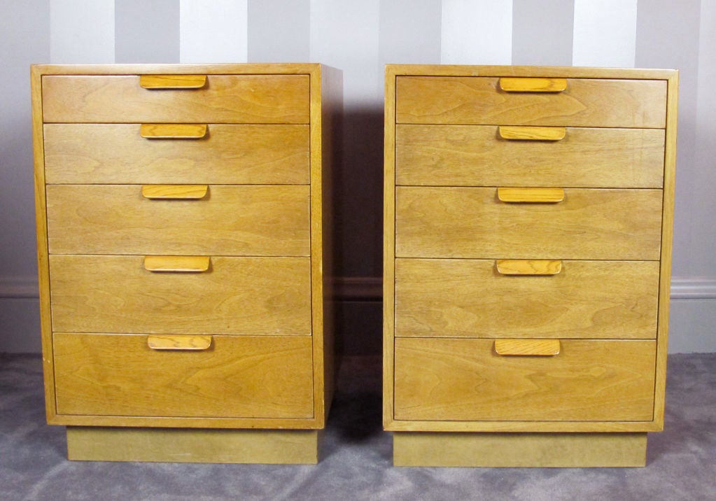 A well-made pair of night stands in bleached mahogany by Edward Wormley for Dunbar. Each consists of five-drawers in graduating sizes with finger handles.  Dunbar label in top drawer. Excellent vintage condition. Matching dresser also available.