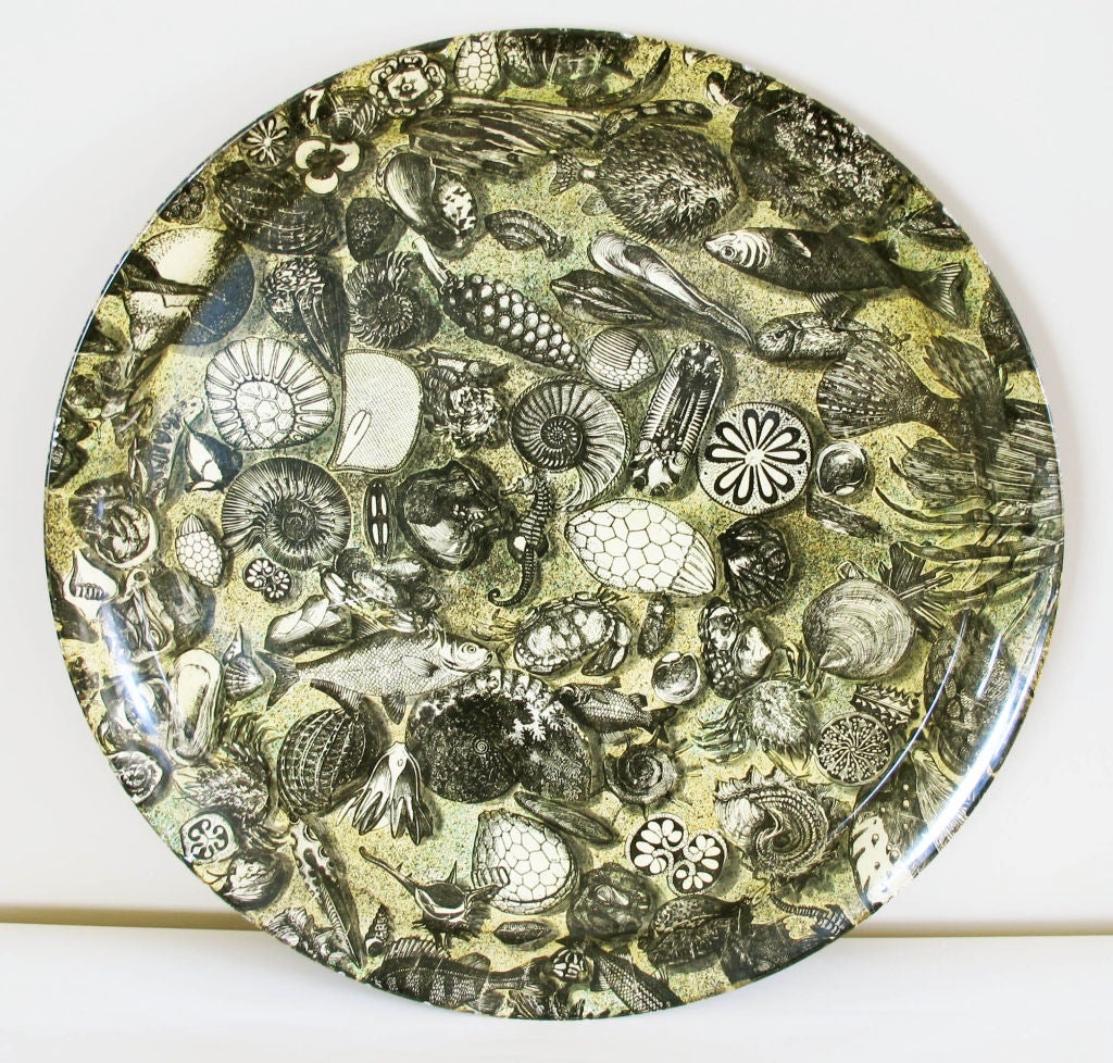 A very large tray depicting marine life by the Italian great Piero Fornasetti.  Very nice original condition.  Label on underside of tray.