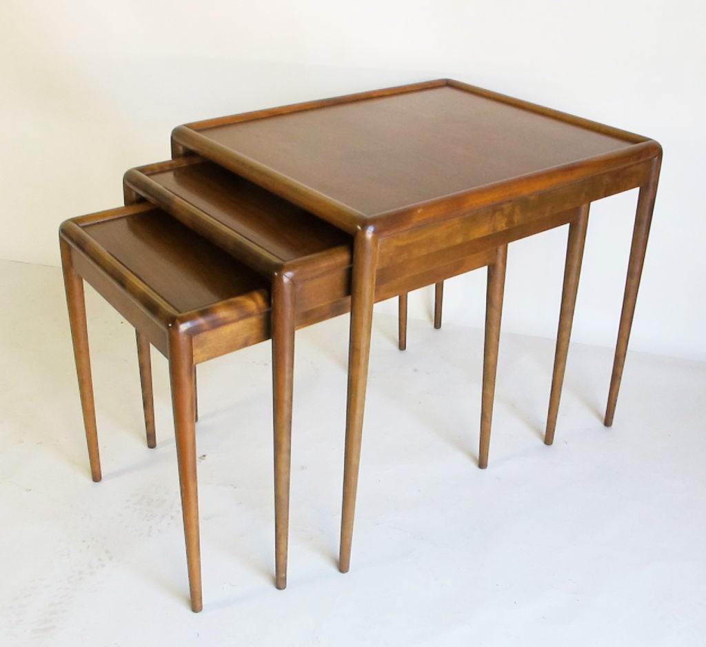 A wonderful set of nesting tables designed by T.H. Robsjohn-Gibbings for Widdicomb.  Original vintage condition.  Original label attached on underside of smallest table.  DImensions of large table are 26