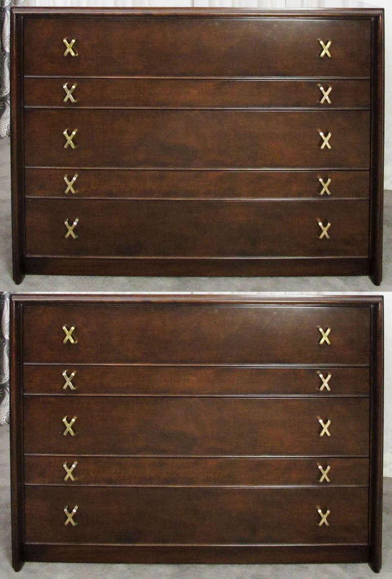 This is a very handsome pair of five-drawers chests by Paul Frankl for Johnson Brothers.  Could be used as dresser or as credenzas.  Beautifully refinished.