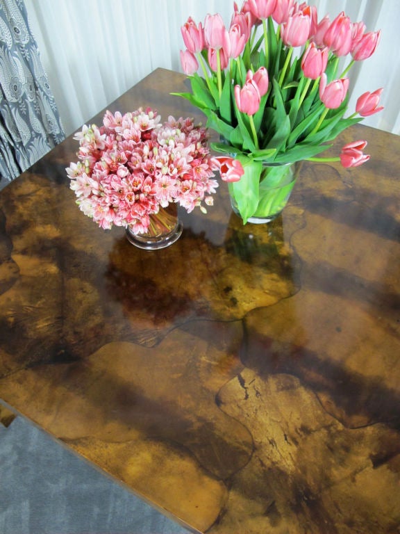 Handsome parchment table believed to be by Aldo Tura of Italy, but has no markings. Beautifully crafted and heavy. As this table has a solid top (was designed without leaves), it would also serve nicely as a large desk or writing table.