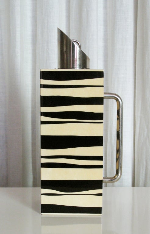 A very good-looking carafe in a black and white zebra pattern parchment by Aldo Tura.  Nickel plated brass fittings.  Pitcher retains original label.