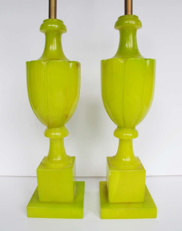 This is an usual and stunning pair of mid century alabaster lamps in a delicious yellow-green color, probably of Italian origin.  The color appears to have been achieved by staining the alabaster and then clear-coating for a lustrous finish.  One