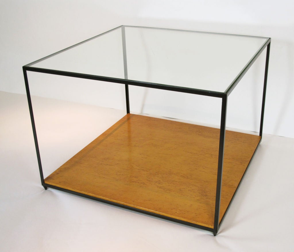 A hard-to-find elegantly simple design by Edward Wormley. Metal frame supports a glass top, which appears to be original. Figured maple lower shelf molded with number 4610 followed by 3 on the underside. Could also be used as an end or side table.