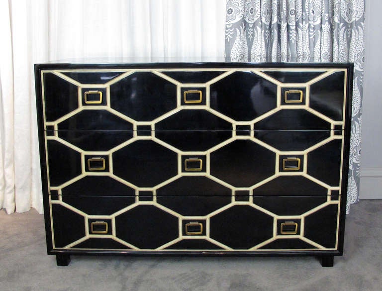 This is a highly dramatic Viennese Collection three-drawer chest or dresser designed by Dorothy Draper for Henredon.  Chest has been beautifully lacquered black and the incised decoration retains its original white and gold-washed finish.  Drawer