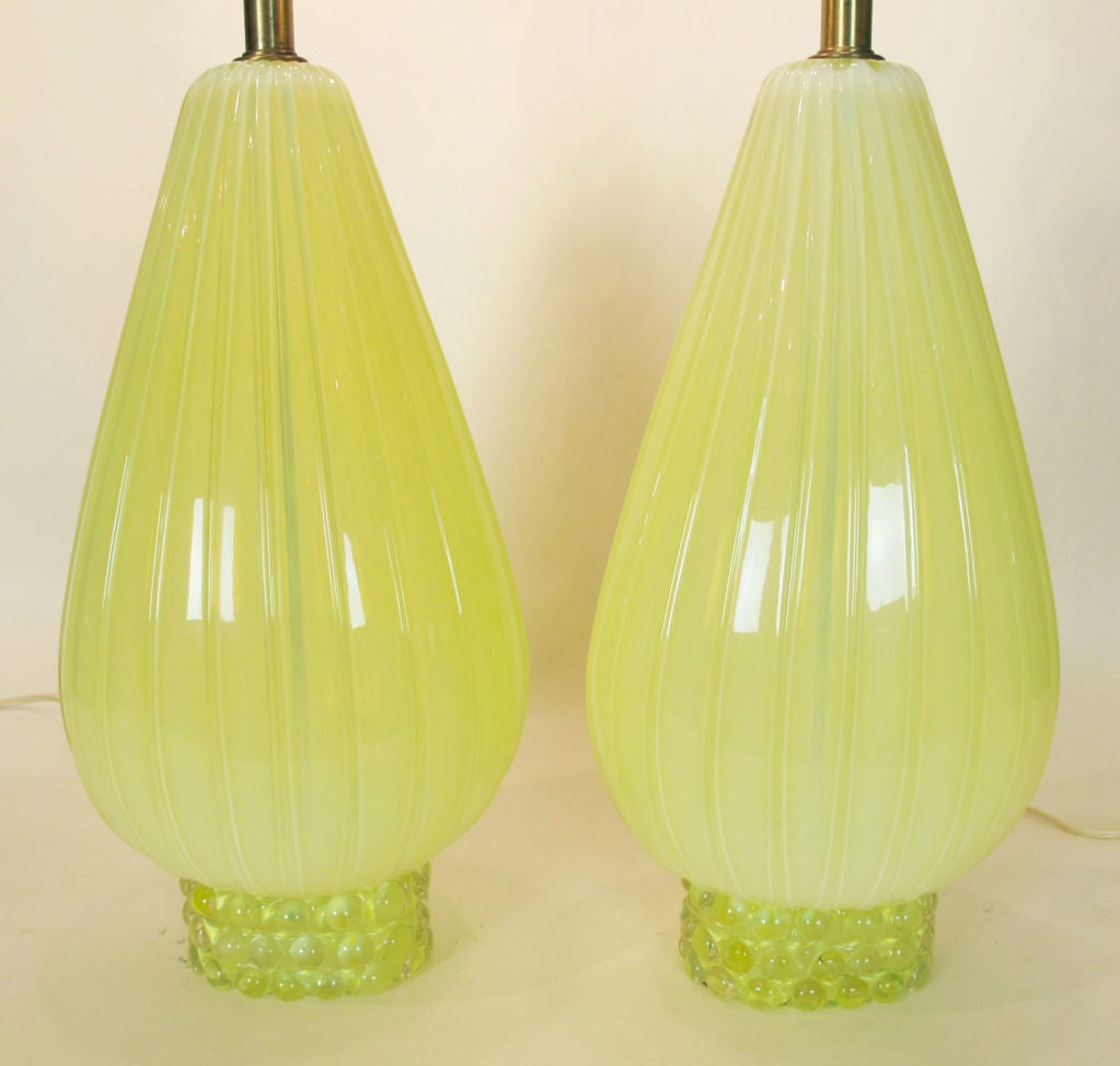 A wonderful pair of  Italian Murano glass lamps by Barovier in an unusual citrine or yellow color.  Lamps measure 17 inches to the top of the glass and with the shades shown, which are not included, the lamps measure 33 inches.  The teardrop shaped