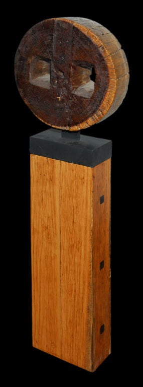 Thai 19th Century Iron Wood  Peanut Grinder Cog On Teakwood Column. For Sale