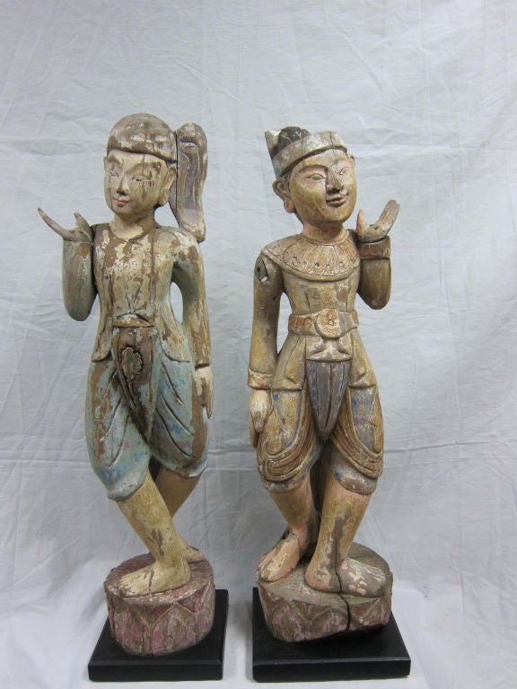 Burmese Folk Art Gong Holders, early to middle 20th century, carved teakwood figures.