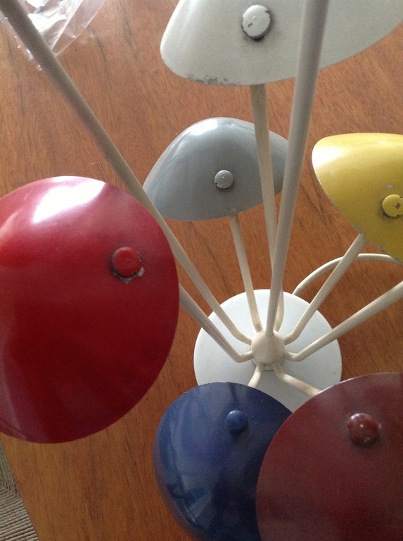 Arteluce
Gino Sarfati's innovative designs for Arteluce are prized by today's collectors. This whimsical table lamp, with eight individual shades each in a different color, is a rare variation. 
