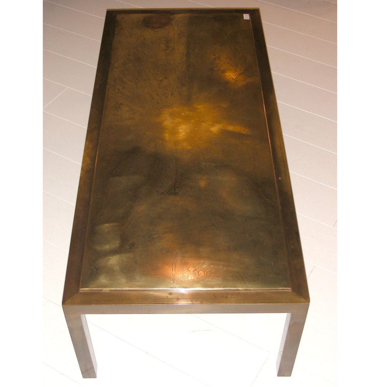 A low table with an abstract sun pattern