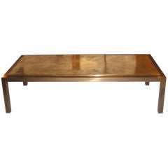 A low table with an abstract sun pattern