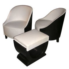 A set of two armchairs and a stoll