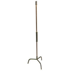 A  floor lamp by JACQUES ADNET