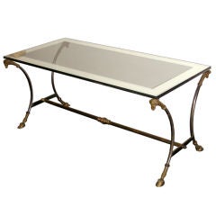 Coffee table in brass and steel,  glass mirror top