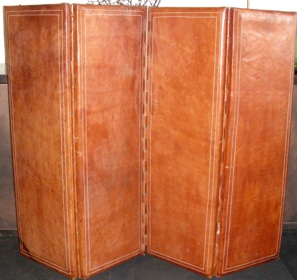 A 1940 STITCHED LEATHER SCREEN