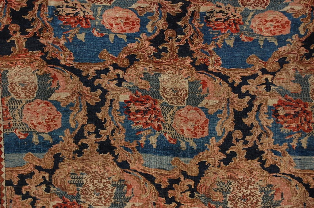 Most unusual Bidjar design. Light blue colors intertwined with a navy background with floral medallions. Very decorative carpet with graceful curves and splendid colors. Bijar was the center of a major weaving area in Persia. Superbly crafted rugs