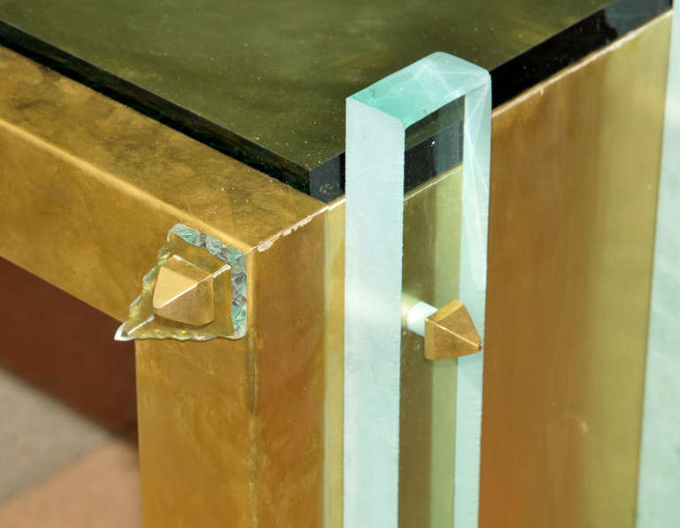 Console table with mirror, glass, brass.