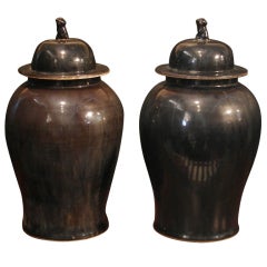 A Pair of Chinese Black Glazed Covered Baluster Jars