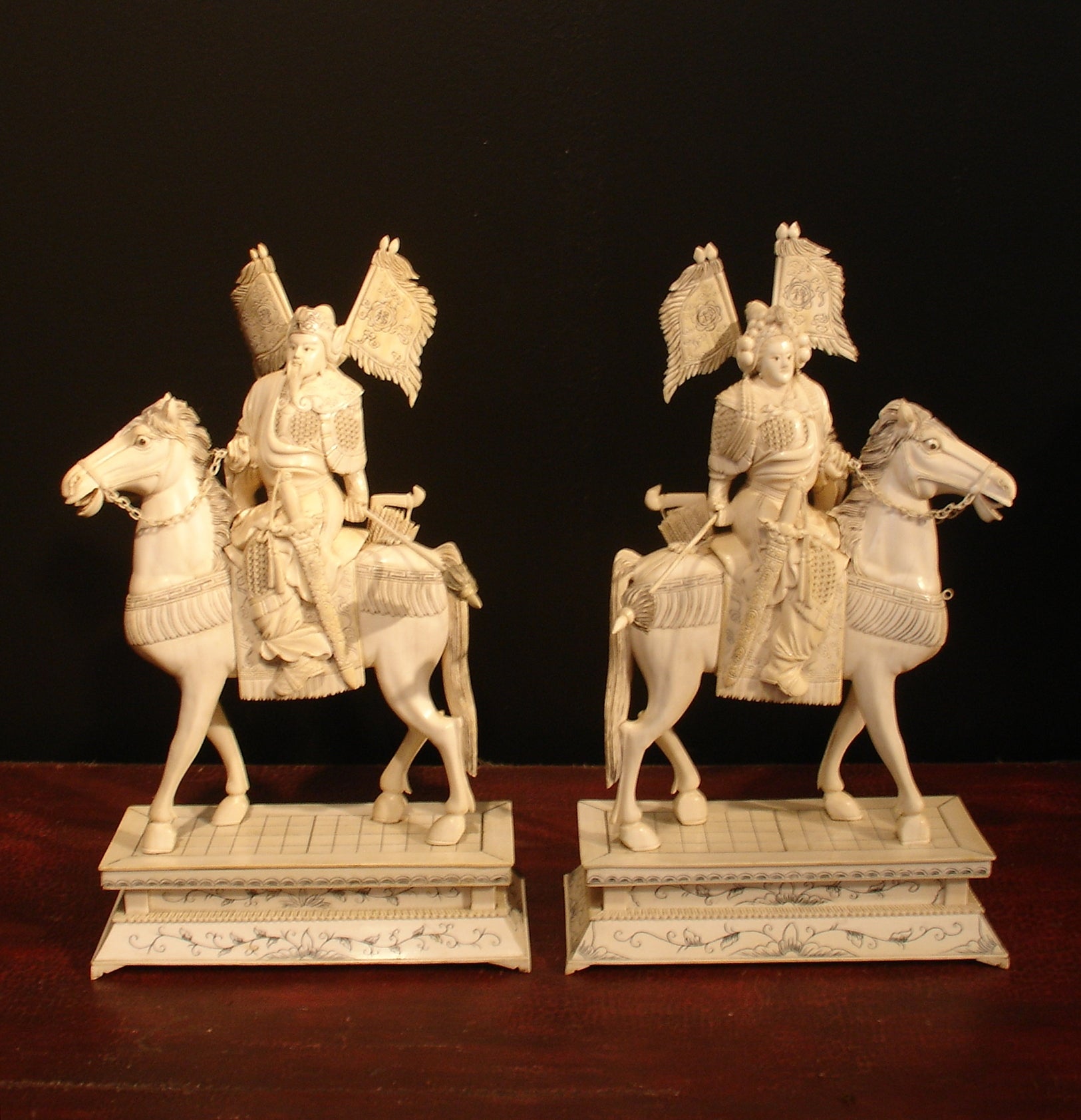 A Pair of Chinese Carved Ivory Warriors on Horseback
