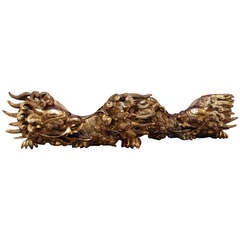 A Pair of Chinese Carved and Gilt Wood Dragons