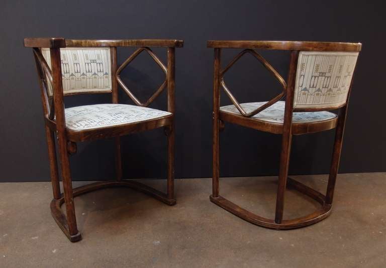 A good pair of period Vienna Secession armchairs designed by Josef Hoffmann in 1905, and manufactured by Thonet in 1910.

The bentwood construction features simple, clean lines and plenty of negative space. The stained ash wood displays a
