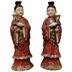 A Pair of Chinese Export Porcelain Famille Rose Court Lady Candle Holders