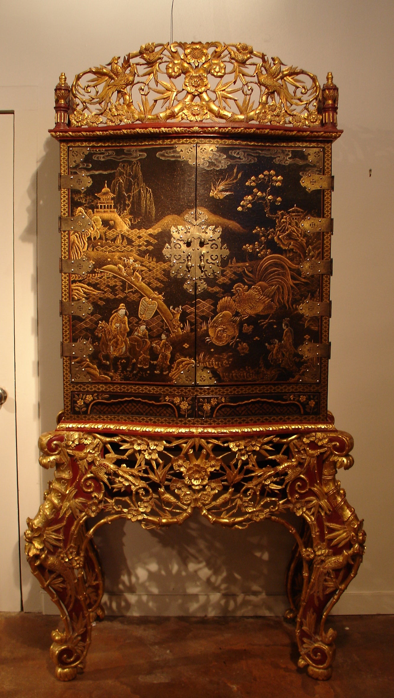 A Japanese Export Lacquer Cabinet on Peranakan Gilt Stand