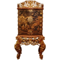 A Japanese Export Lacquer Cabinet on Peranakan Gilt Stand