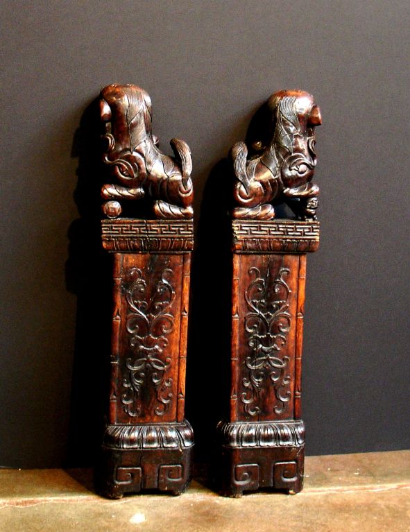 A Pair of Carved Rosewood Foo Lions 1