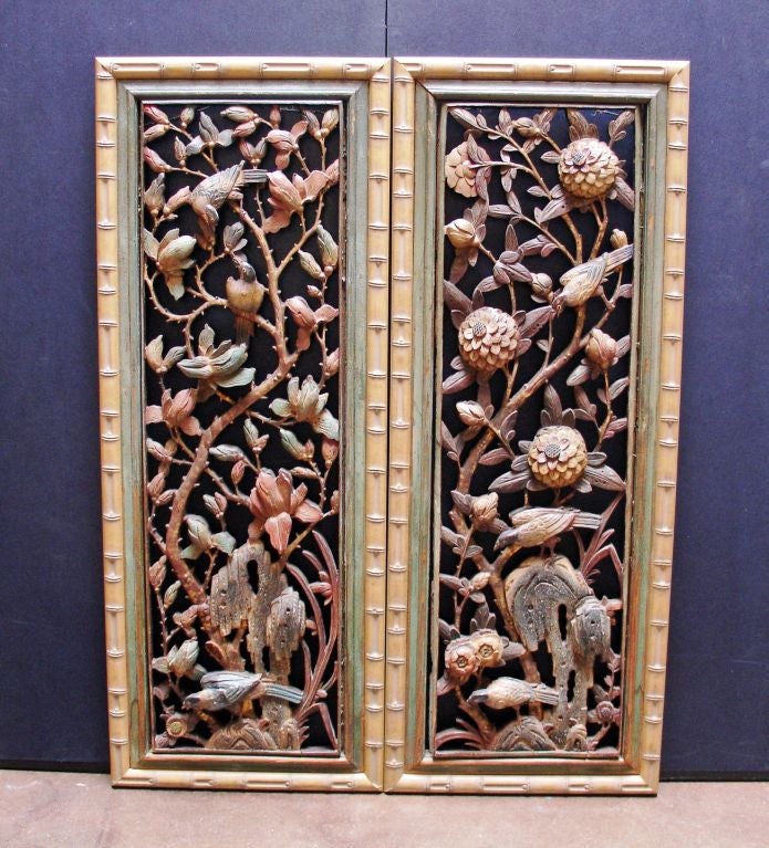 A pair of carved and polychromed Chinese panels depicting kingfisher birds (symbols of peace and prosperity) amongst flowers, vines, and a naturalistic rocky outcropping.<br />
<br />
Possibly originally part of a window or screen.<br />
<br