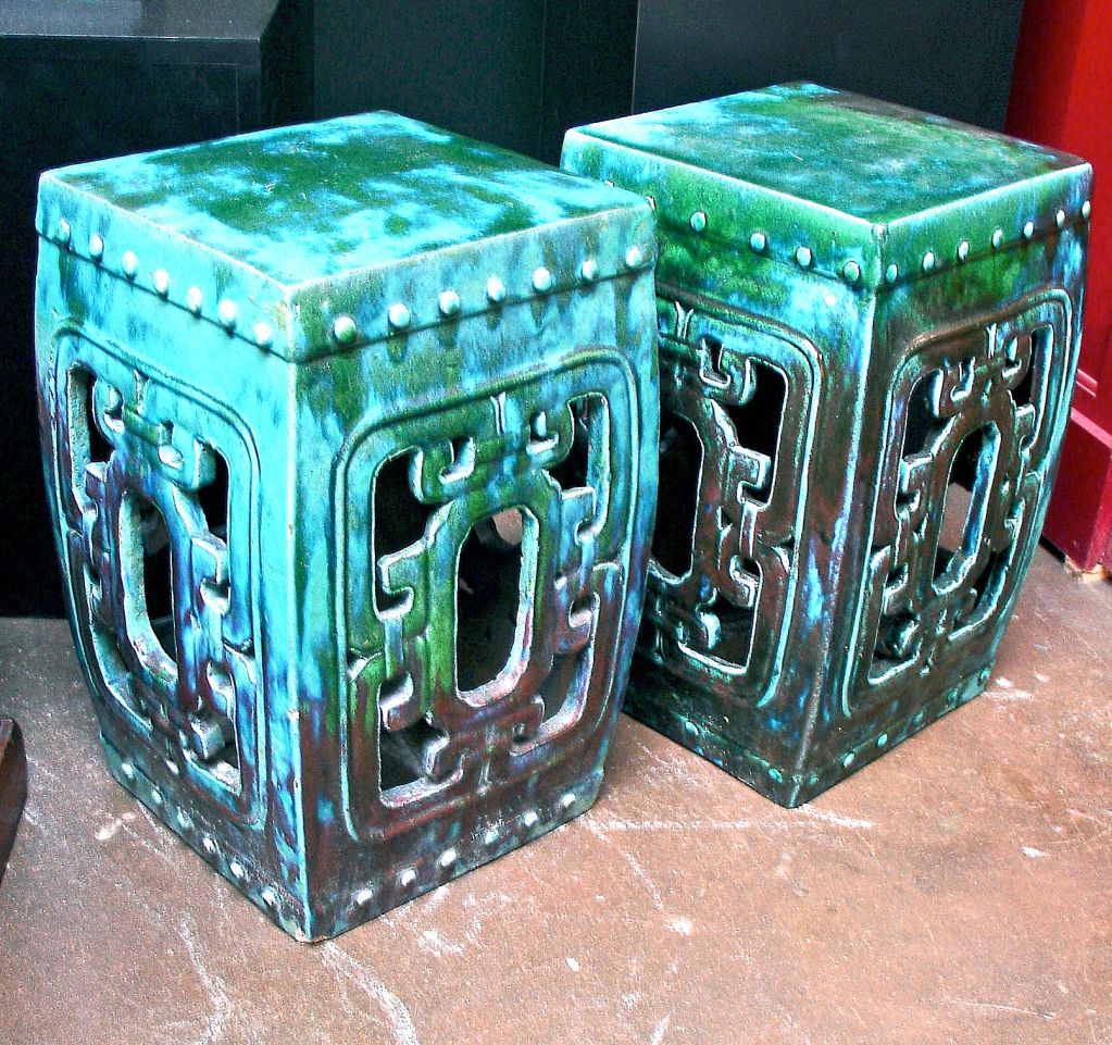 A pair of square Chinese garden stools in an amazing flambe glaze, with hues ranging from bright turquoise, to apple green, to aubergine.<br />
<br />
Priced individually.