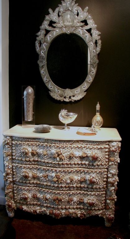 A Shell And Mineral Encrusted Commode