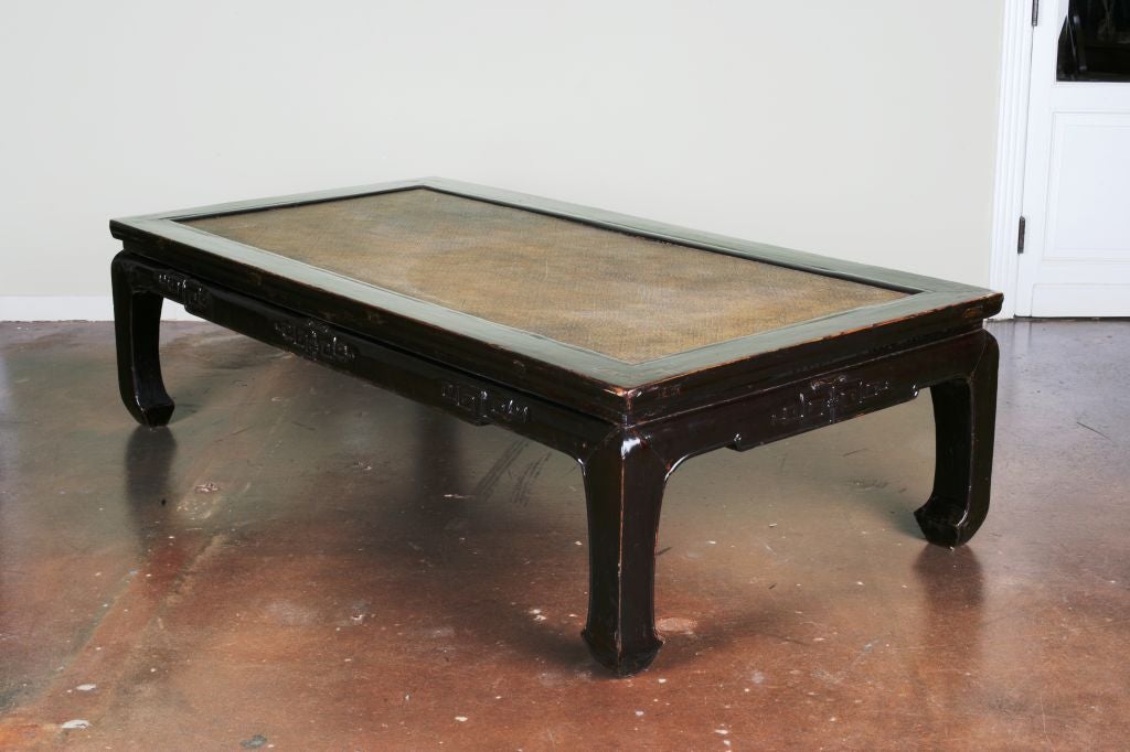 An oversized, beautifully proportioned daybed, suitable for use as a centre table. Subtle, low relief carved key fret pattern and horse hoof legs complete a fine and elegant example of classical Chinese furniture.