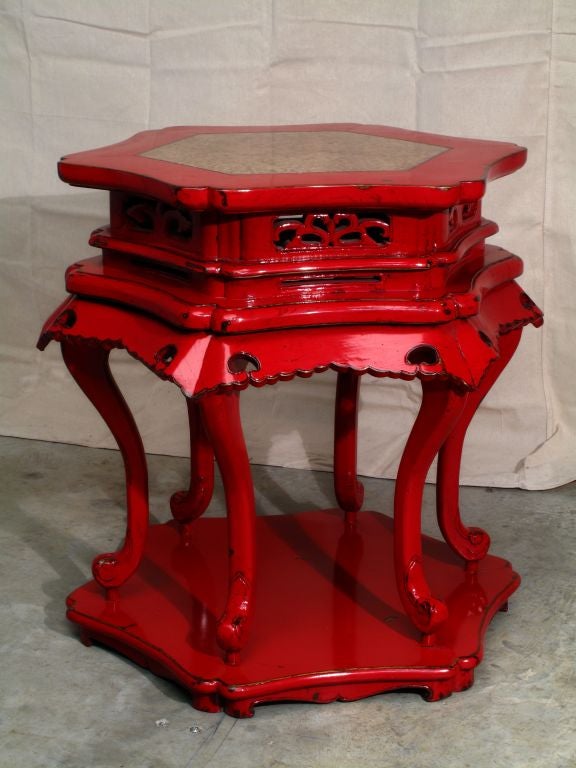 A Chinese Red Lacquer Hexagonal Table with Stone Inset Top
