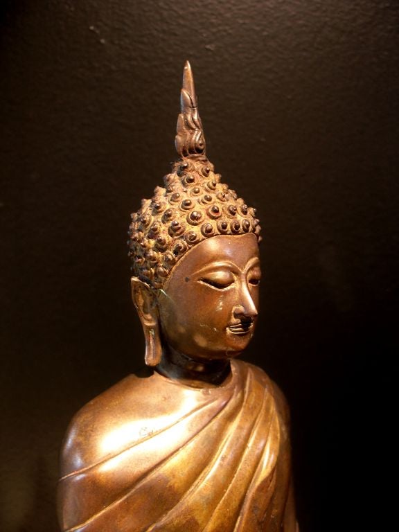 A Thai Bronze and Parcel Gilt Standing Buddha 1