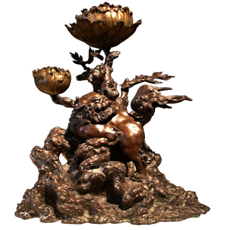 A Japanese Bronze Shishi Lion FormTemple Candle Holder