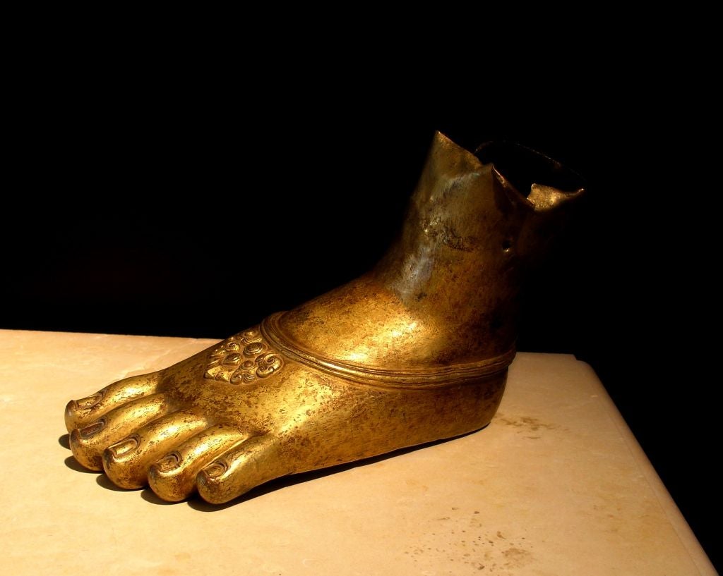 A fragmentary left foot of a bodhisattva. <br />
<br />
From what originally would have been a life-size statue, this foot is crafted in the repousse technique and features a rich overall gilding. The toes realistically rendered with elegant