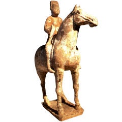 A Tang Dynasty Pottery Model of a Horse and Noble Rider