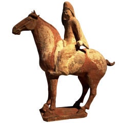 A Tang Dynasty Pottery Model of a Horse and Rider